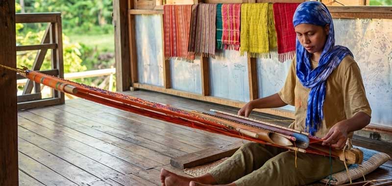 Yakan weaver working a traditional loom at Yakan Weaving Village, Zamboanga City