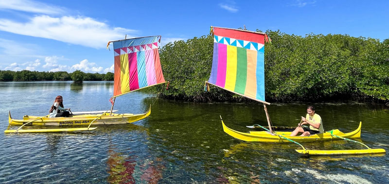 Yellow boat mangrove tour near Sta. Cruz Island