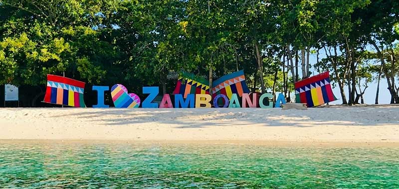 I Love Zamboanga sign on the beach at Great Santa Cruz Island with calm turquoise water