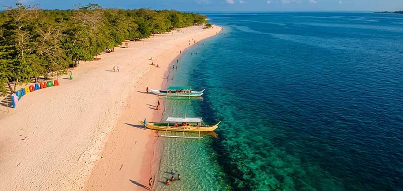 Sunny dry season day at Pink Beach sandbar in Zamboanga City